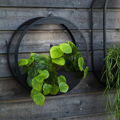 Potvormige wandlamp op zonne-energie